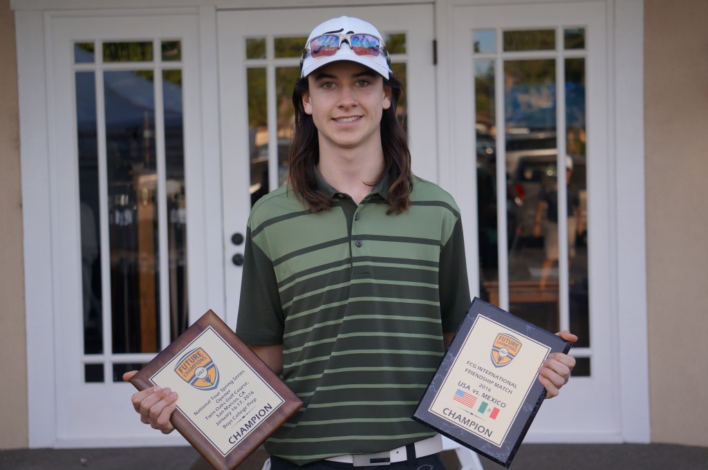 Shane Muldowney holding FCG trophies. 